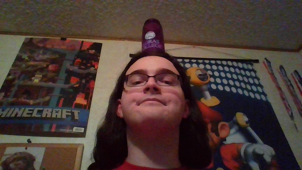 A picture of me balancing a water bottle on my head