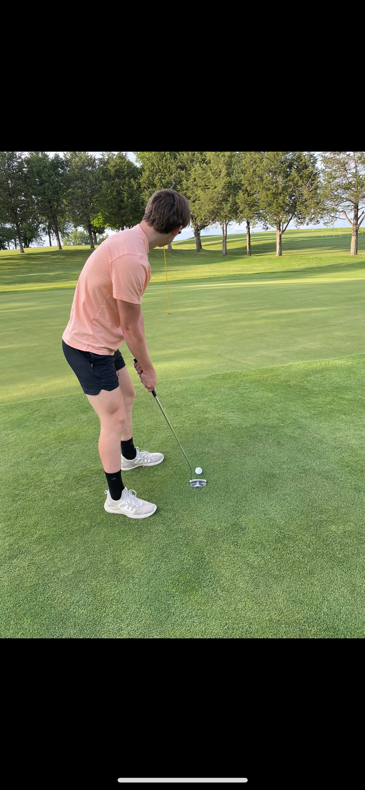 this is a photo of my friend golfing