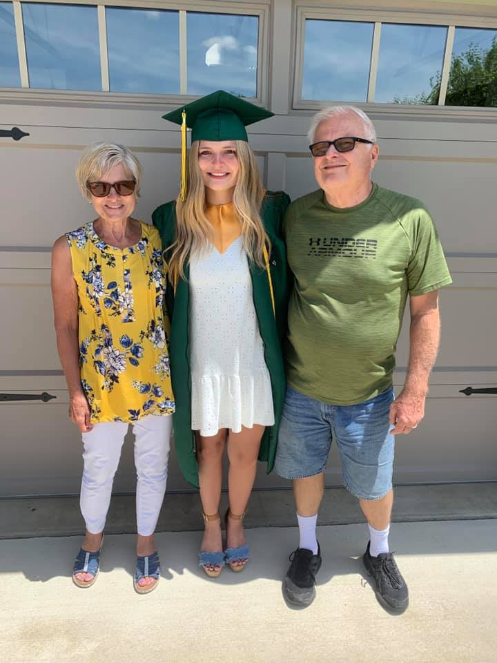 photo of me on graduation day with my grandparents