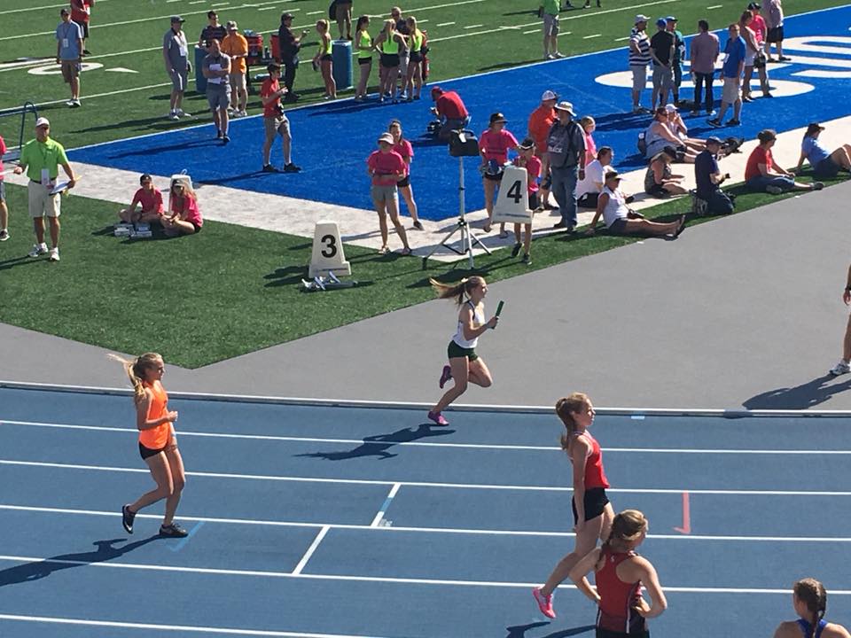 photo of my running on the blue oval at state track