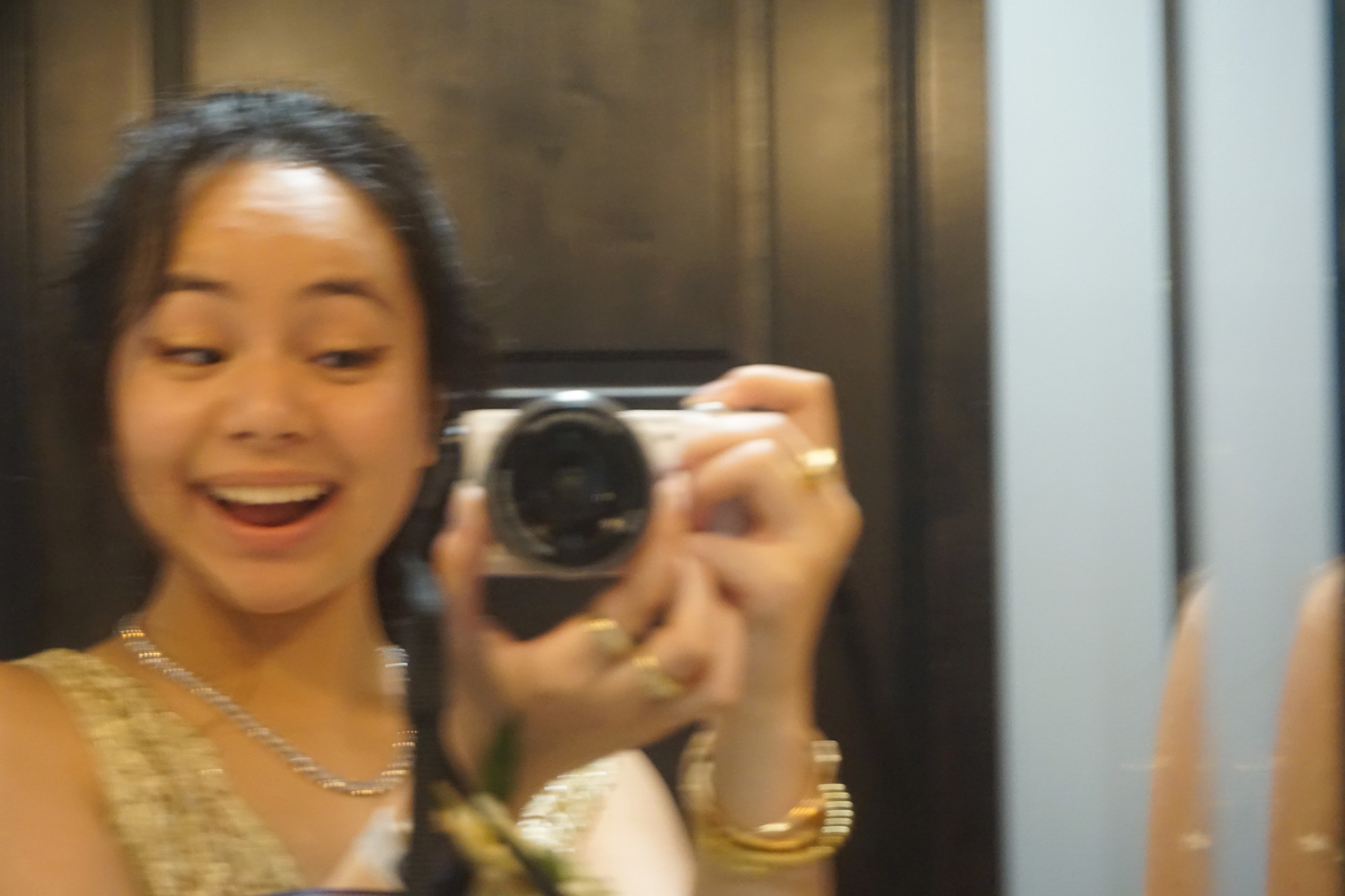gabby taking a picture with my camera in the mirror