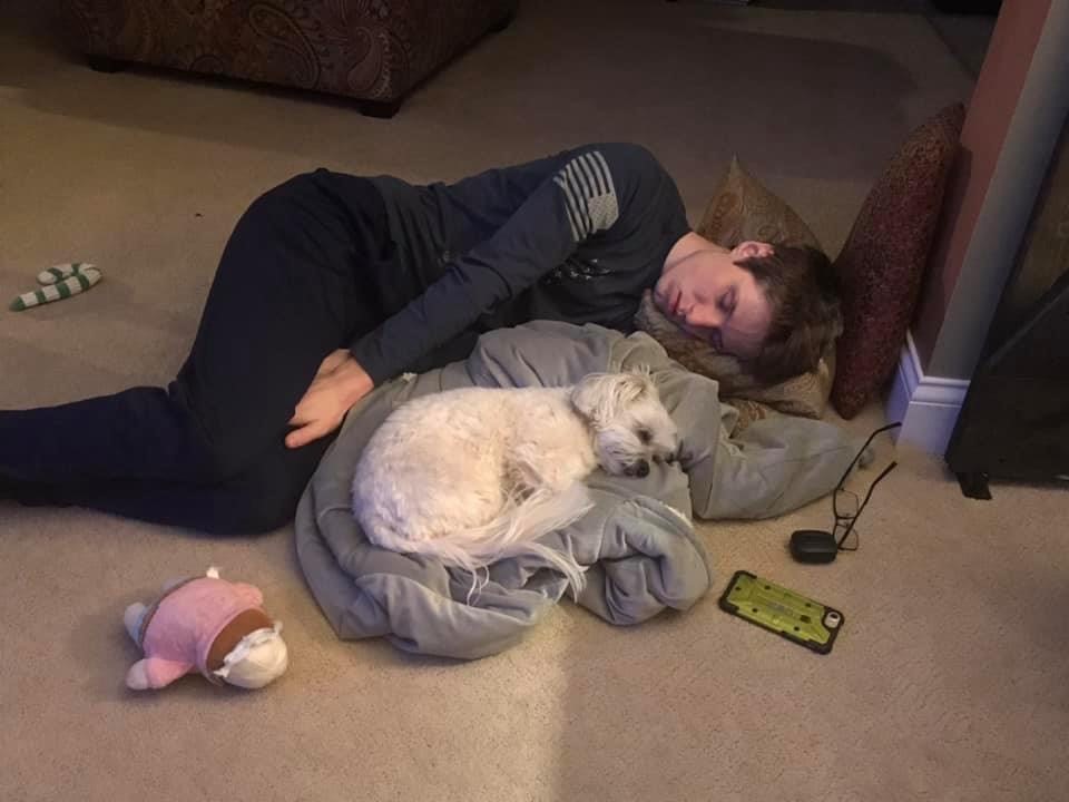 another picture of nate sleeping next to our little dog