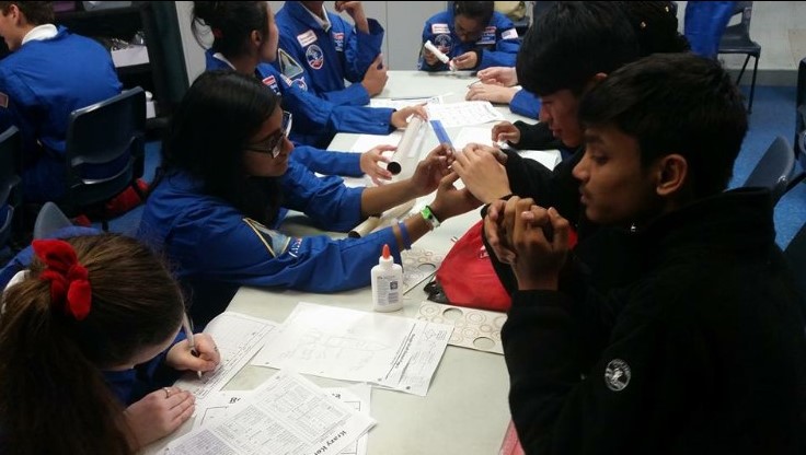 Gabi filling out papers at Space Camp