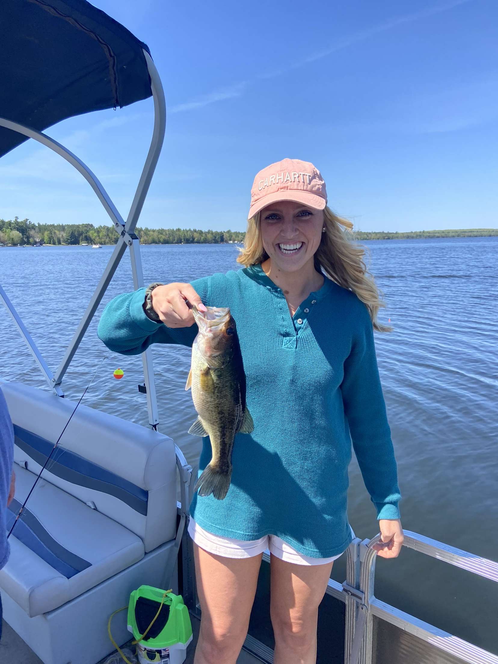 Photo of Genevieve catching a large mouth bass