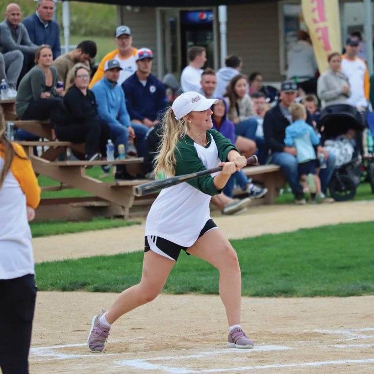 Photo of Genevieve hitting at the Field of Dreams