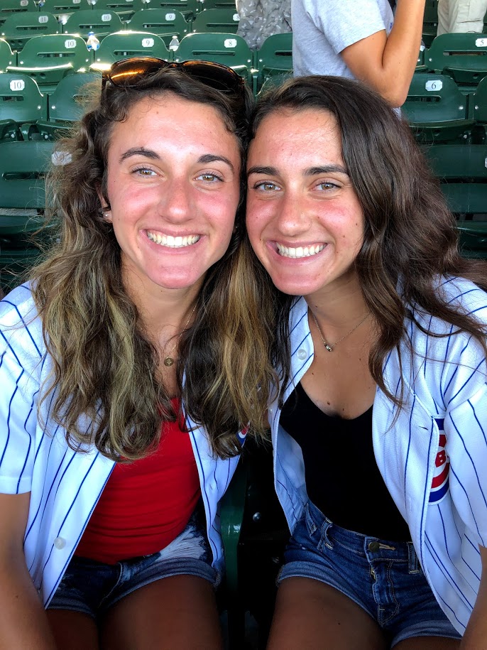 Here is a picture of my sister and I at a Cubs Game.