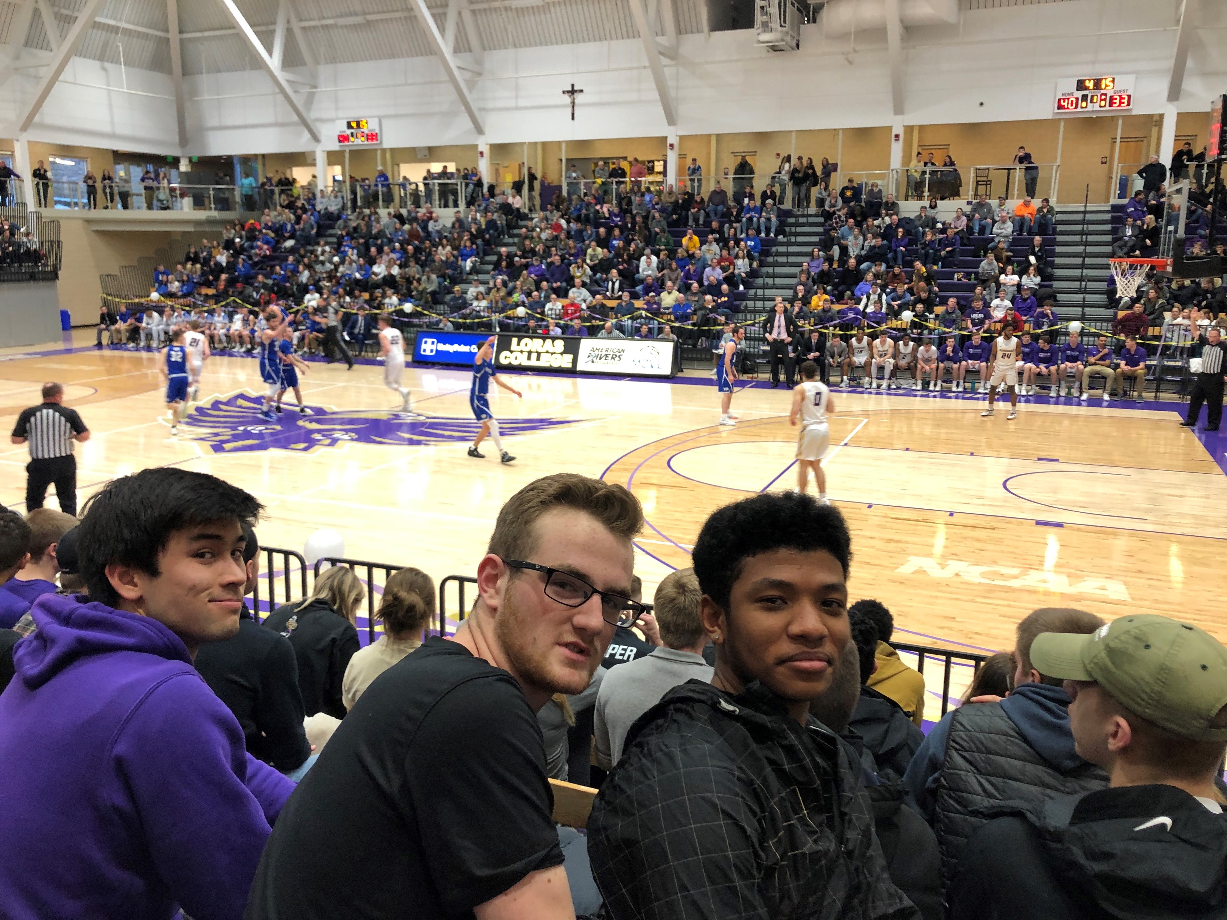Photo of Lucas at basketball game with friends